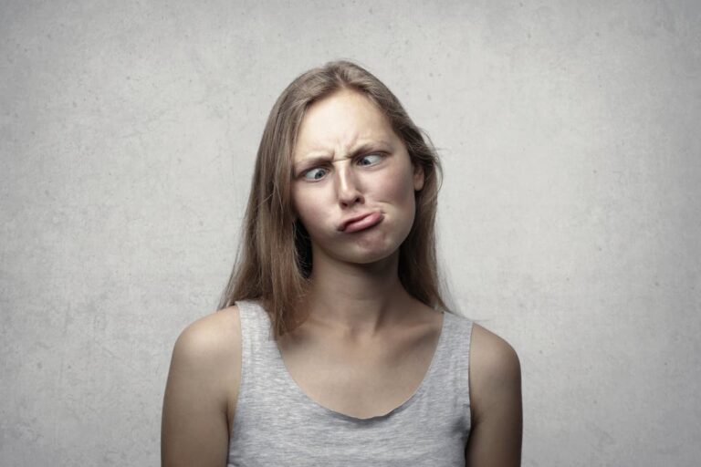 puzzled woman in vest top