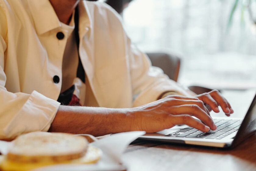 Person typing on a laptop