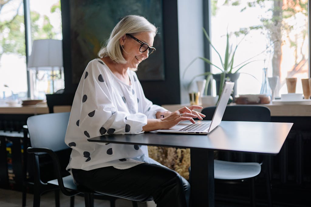 Woman typing on a laptop